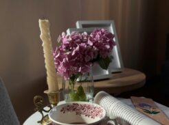 Homeschooling children around a table with books and tea