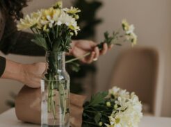 Overwhelmed homemaker standing in a cluttered kitchen preparing to start a simple home reset routine.