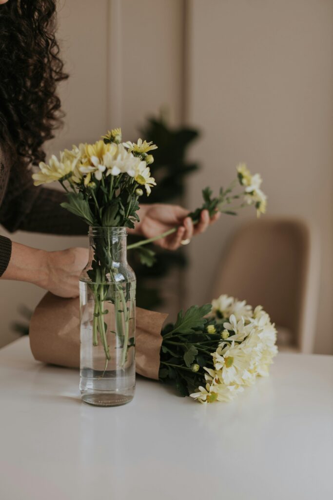 Overwhelmed homemaker standing in a cluttered kitchen preparing to start a simple home reset routine.
